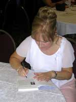 Linda signing her book